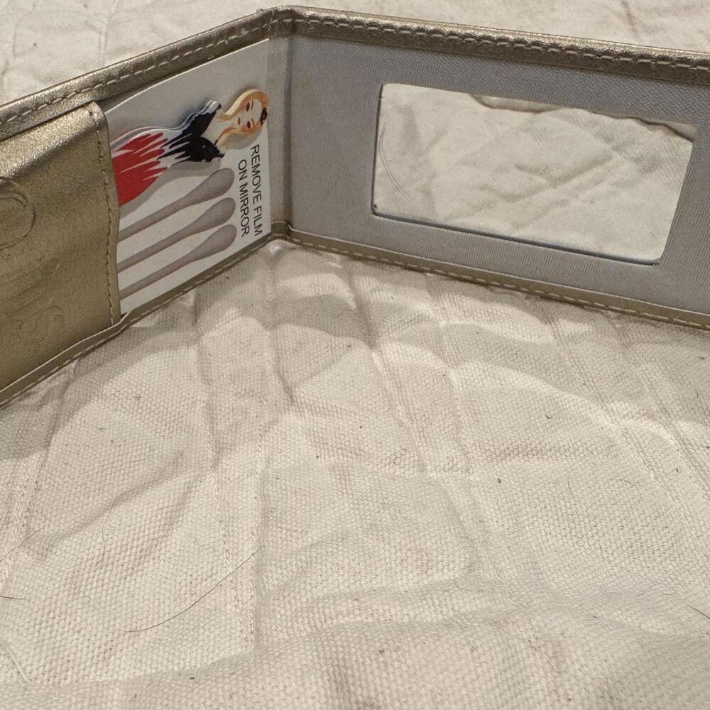 Vintage tan and cream Q-tips wallet with a touch of glamour.